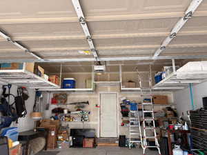 Garage featuring a garage door opener
