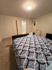 Bedroom with carpet flooring and baseboards