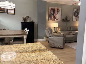 Dining room featuring light wood finished floors and a ceiling fan