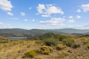 View of mountain background featuring a large body of water