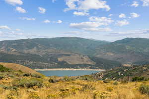 View of mountain backdrop with a nearby body of water