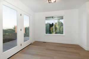 Empty room featuring light wood-type flooring and baseboards
