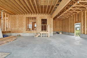 Miscellaneous room with unfinished concrete flooring