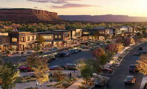 Back of property featuring a mountain view and uncovered parking