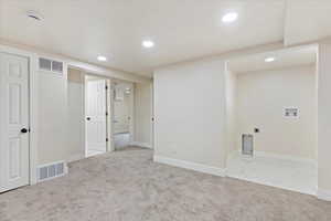 Basement with carpet and recessed lighting