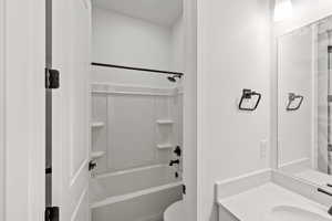 Full bath with vanity and tub / shower combination