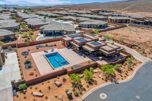 Aerial view of residential area with mountains and a pool area