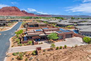 Aerial view of residential area featuring a mountain backdrop