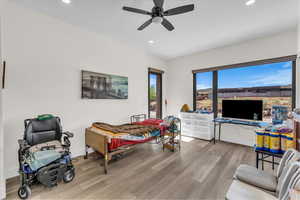 Bedroom with access to outside, recessed lighting, light wood-style flooring, and ceiling fan
