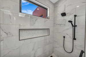 Bathroom with tiled shower