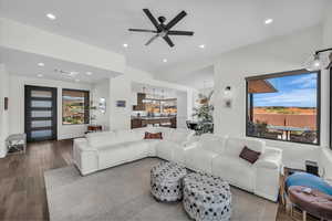 Living room featuring wood finished floors, recessed lighting, and a ceiling fan