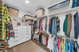 Spacious closet featuring wood finished floors