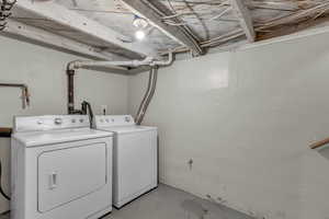 Laundry room featuring independent washer and dryer