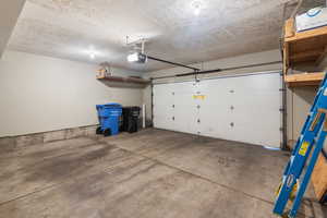 Garage featuring a garage door opener