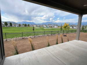 Fenced backyard with a residential view, a patio area, and a mountain view