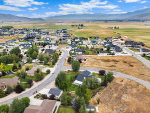 View of property location featuring nearby suburban area and mountains