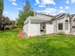 Sanctuary Patio off the Owner's Suite with privacy fence and pergola,,