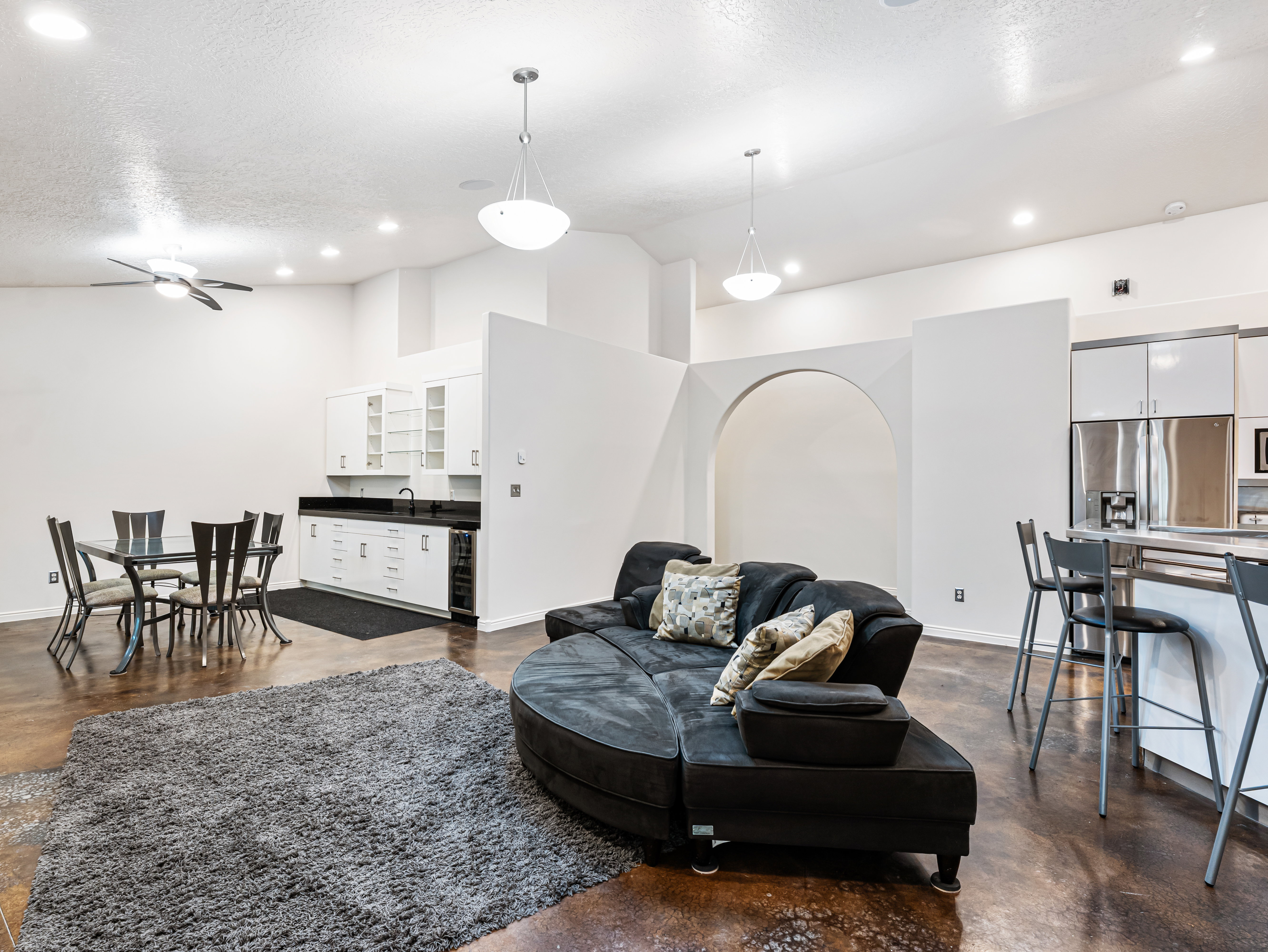 Great Room with Kitchen, Lounge Area and a larger Dining Area with a wet bar and Fridge.