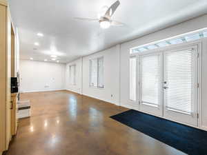 Entrance foyer with a ceiling fan, finished concrete floors, a textured ceiling, french doors, and recessed lighting