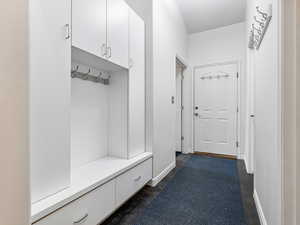 Garage Entrance with Laundry to the left, large Storage to the right,  Tons of storage and a 1/2 bath..