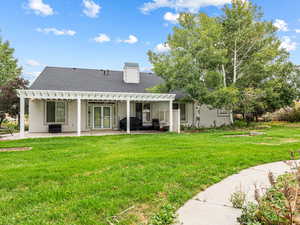 Rear view of the home and back patio.