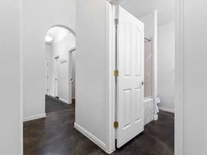 Corridor with arched walkways and finished concrete floors