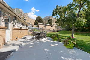 View of patio / terrace featuring a mountain view and outdoor dining space