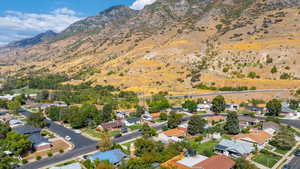 Aerial view of residential area featuring a mountain backdrop