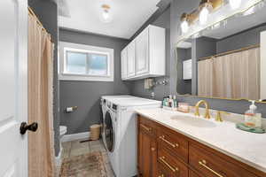 Washroom featuring light tile patterned flooring and baseboards