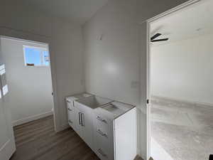 Bathroom featuring vanity and a ceiling fan