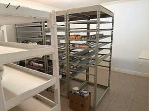 Finished Storage Room.  Built in shelving along one wall.