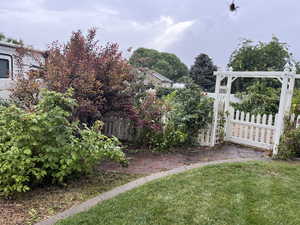 View of yard, gate to garden area