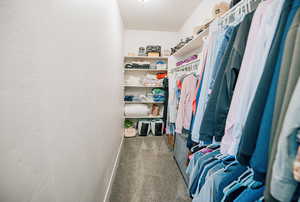 Walk in closet featuring carpet flooring