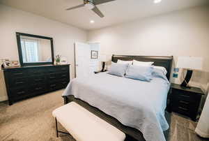 Bedroom featuring light colored carpet, recessed lighting, and ceiling fan