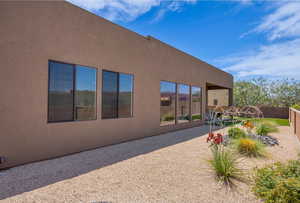 Back of property featuring stucco siding and a patio area