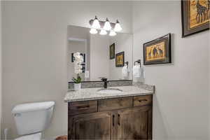 Bathroom featuring vanity and toilet