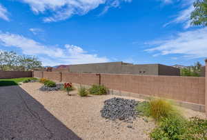 View of fenced backyard