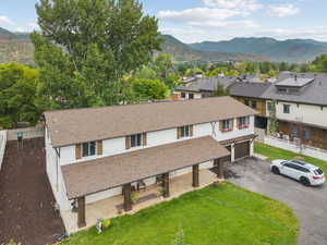 Aerial perspective of suburban area with a mountain backdrop