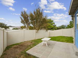 Fenced backyard featuring a patio area