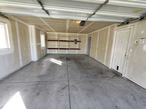 Garage with a garage door opener and electric panel