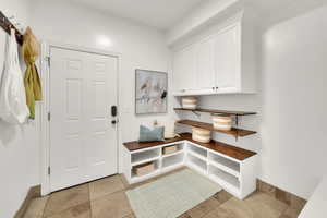 Garage access through mudroom located off kitchen with adjacent 1/2 bath (not shown)