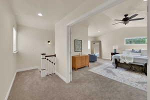 Spacious primary bedroom with vaulted ceiling