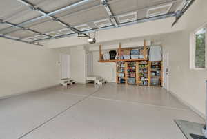 Attached extra-large 2-car garage with storage and access to backyard