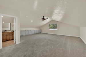 Enormous flex space with adjacent 1/2 bath and tons of storage and a pull-out craft desk (not shown)