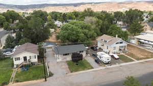 Aerial perspective of suburban area with a mountainous background
