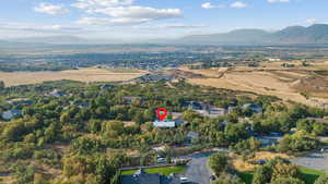 Aerial view of property's location with a mountainous background
