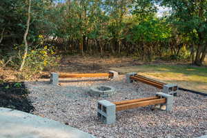 View of yard featuring a fire pit
