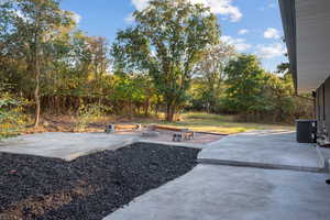 View of yard with a patio area and view of scattered trees