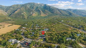 Aerial view of property's location featuring mountains