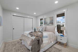Bedroom featuring recessed lighting and a closet